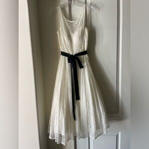 White lace dress with grosgrain bow. Only been worn once.